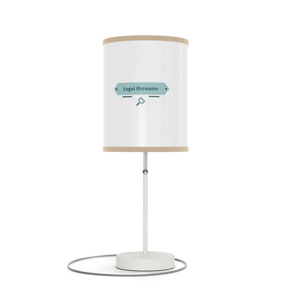 Stylish table lamp on a sleek stand with customizable shade; US|CA plug with elegant silver finish.